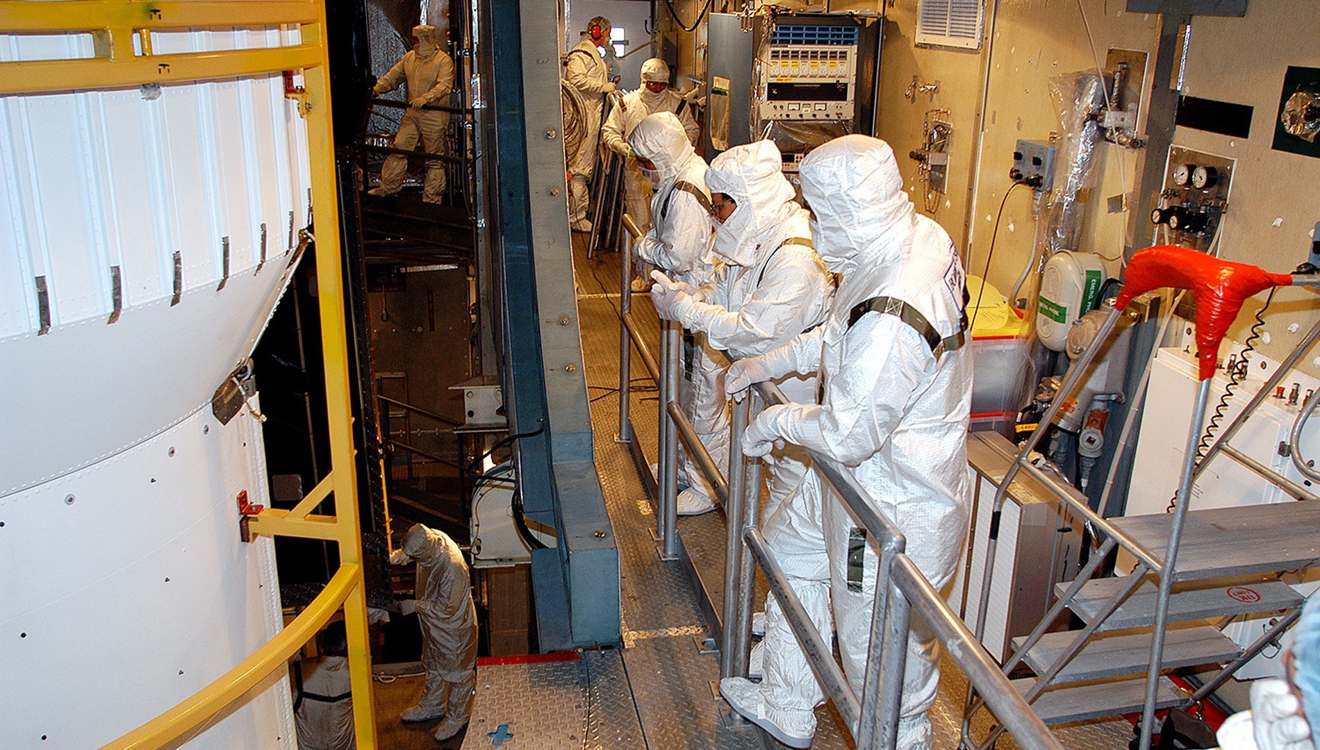 7 of 11. On August 14, 2003, the Spitzer Space Telescope was secured into the faring on top of the Delta II rocket that launched it into Earth-trailing, heliocentric orbit. (Credit: NASA/KSC)