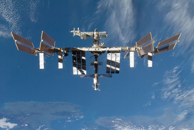 The International Space Station Over Earth (Credit: STS-128 Crew, NASA)